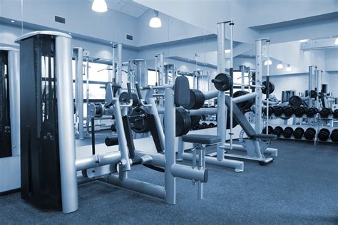 Weight room with racks and mirrors